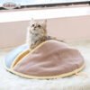 1b40b2044d4bb78a321d0a36b3a8 Fluffy cat in cozy pastel cat bed on soft rug by a sunny window