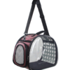 Transparent cat carrier bag with mesh window, paw print design, and adjustable shoulder strap