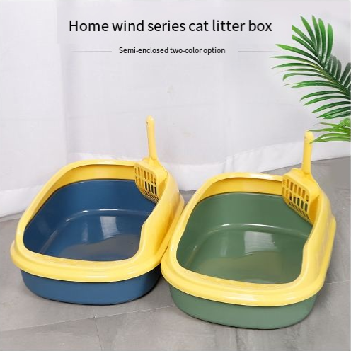 Semi-enclosed cat litter boxes in yellow with blue and green bases, matching scoops included