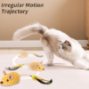Cat chasing interactive plush mouse toy with feather tail on indoor carpet