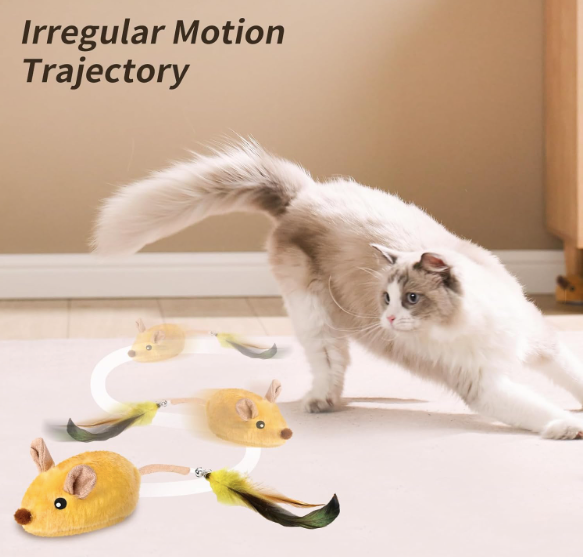 Cat chasing interactive plush mouse toy with feather tail on indoor carpet