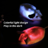 Two light-up plush mouse cat toys glowing in the dark with colorful LED lights.