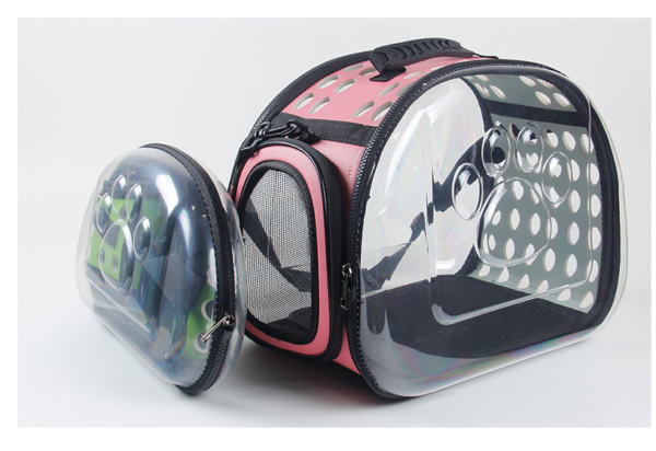 Pink transparent cat carrier with paw print design and mesh ventilation.