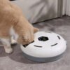 d221a0298b4a98801d6ddac2bf92e7ef Cat eating from an automatic feeder on a gray tile floor